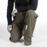 Tactical Waterproof Trousers: Black pants with extended back for enhanced coverage.